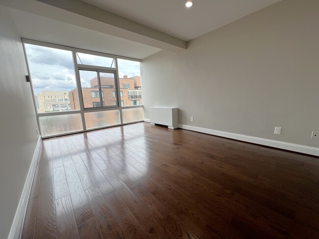 Bedroom with floor to ceiling windows - 730 24th St NW