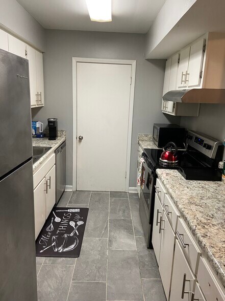 Kitchen with door leading to pantry/ laundry room - 6005 Wingate Way