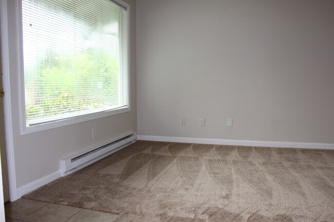 Living room has a large window to bring in natural light - 1211 Dumas Road