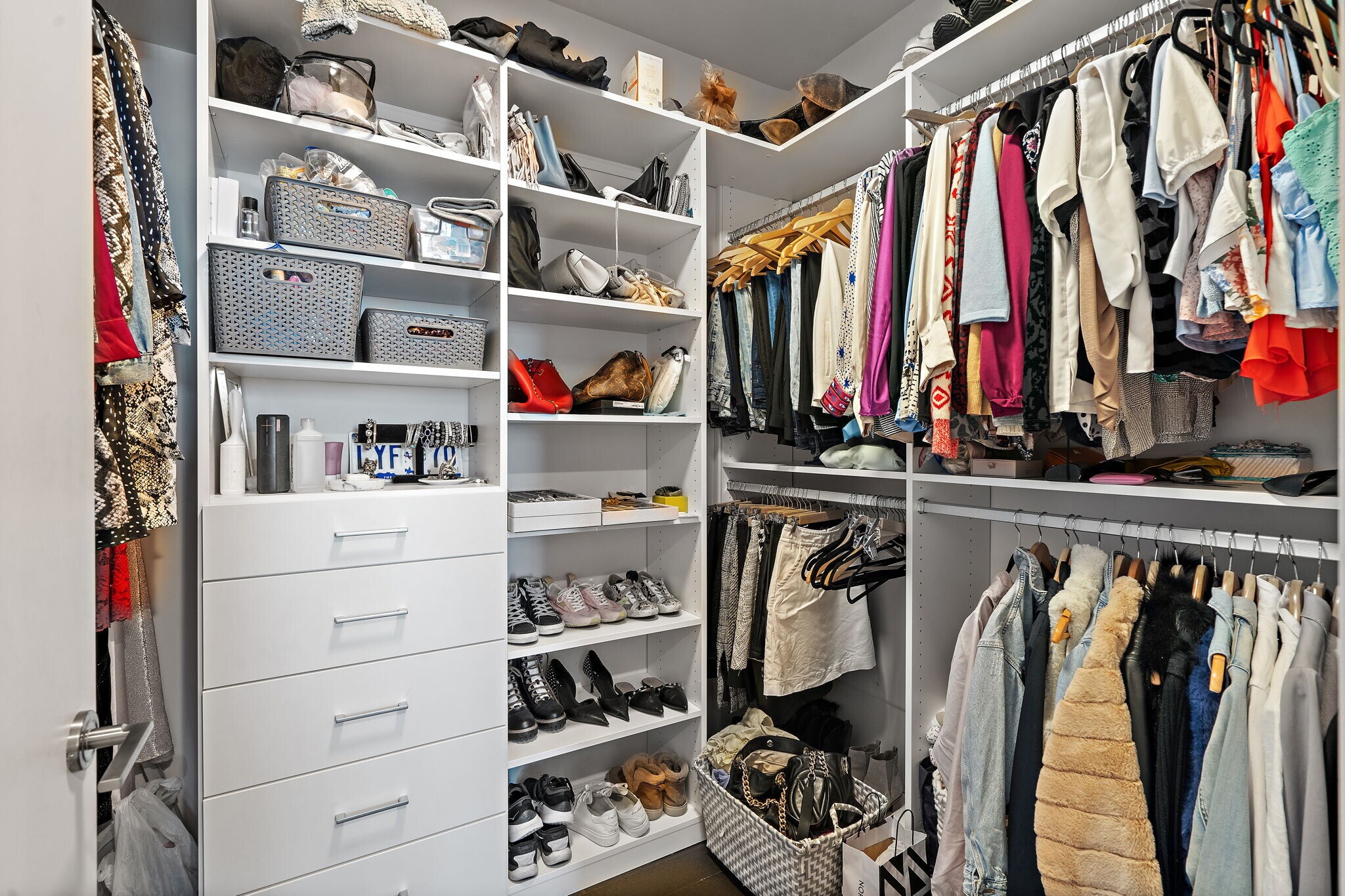 Extra large primary walk in closet with built-ins by California Closets - 515 Church St