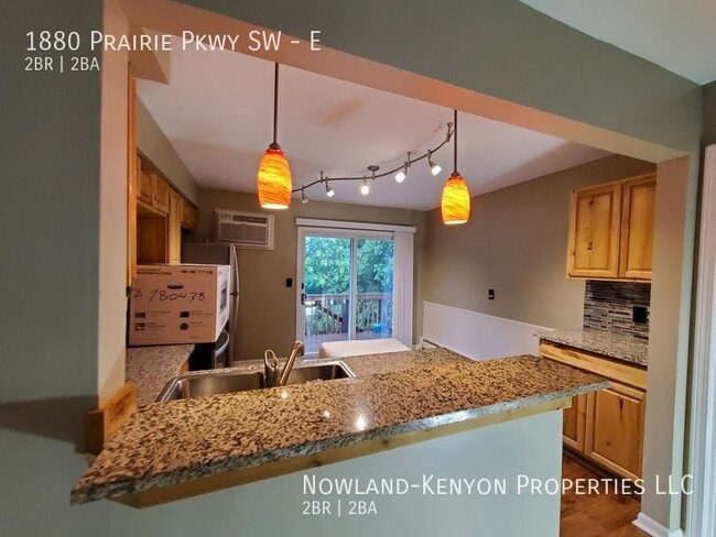 Building Photo - 1880 Prairie Pkwy SW - E- 2 beds, 1 full bath