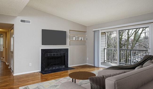 Spacious central living room with wood plank flooring - Burke Shire Commons