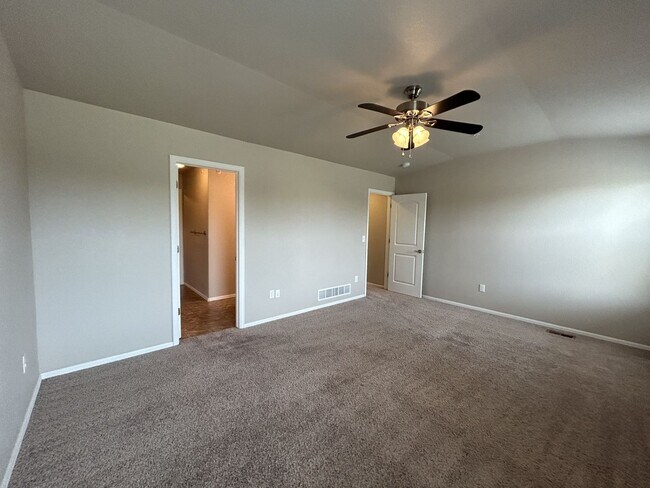 Building Photo - $500 Off First Month Of Rent! Modern 3BR Townhome with Fenced Yard & Garage