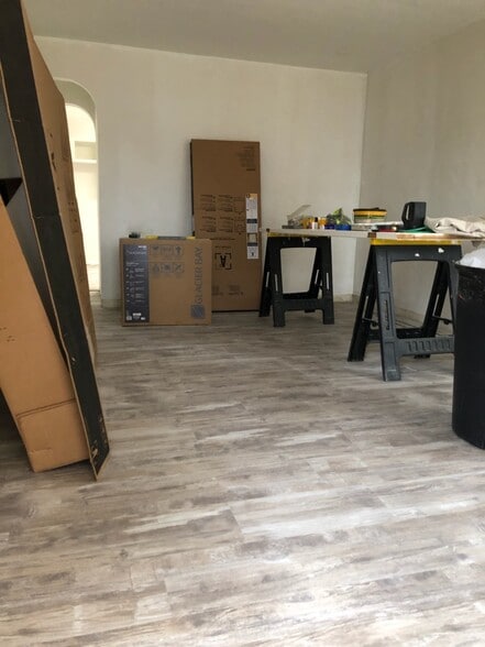 Reno update: Living Room; highlighting floors and layout. What's next? Paint touch ups, new trim, new baseboards, new counter tops, and new doors. - 1395 Ross Ave
