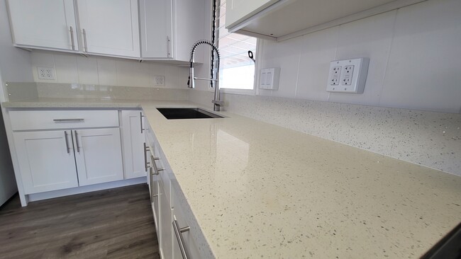 Quartz countertop with multiple outlets - 2342 Ahakuka Pl