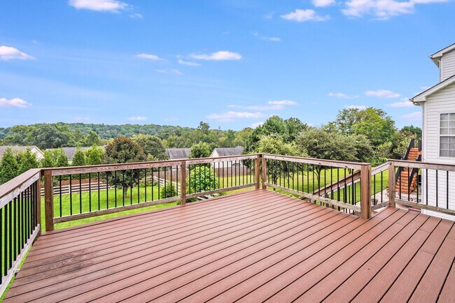 Building Photo - Enjoy Riverfront Living! Spacious 4-Bedroo...