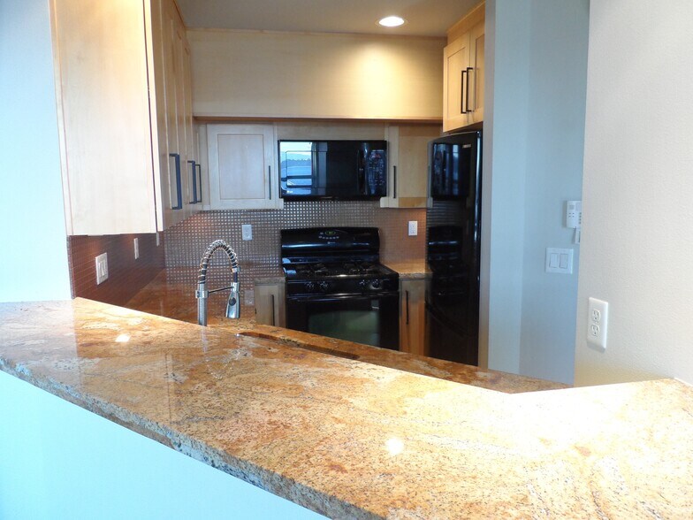 kitchen with eating bar seats 4 - 335 Lakeside Ave S