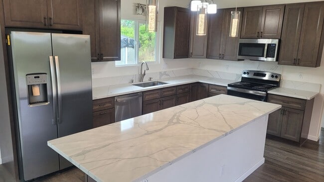 Building Photo - This 3-bedroom, 2-bath home in Orchidland Subdivision