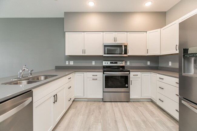 Building Photo - Spacious Townhome with Heated Garage Just ...