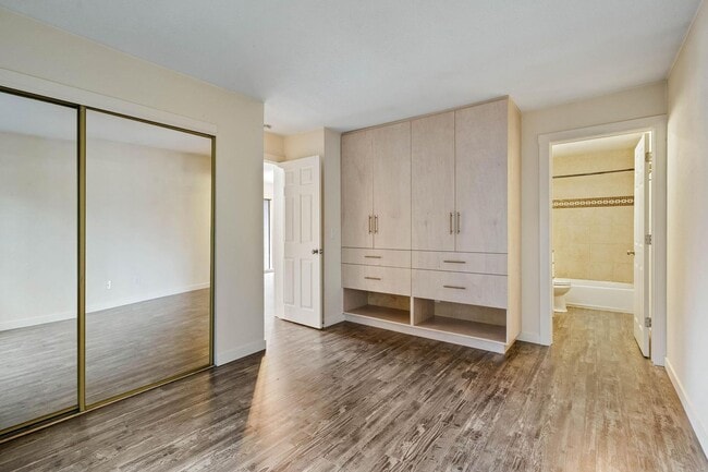 Building Photo - $500 off! Spacious 1-bdrm/1-bath condo in quiet neighborhood. Balcony, 2 parking spaces, fireplac...