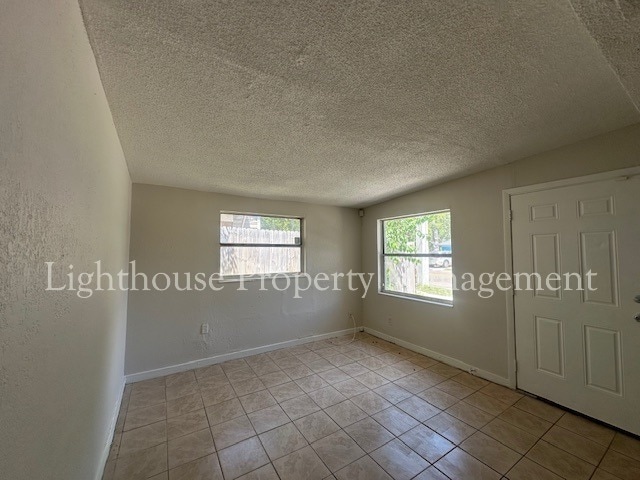 Building Photo - Bright 4 Bedroom Home With Tile Flooring Throughout