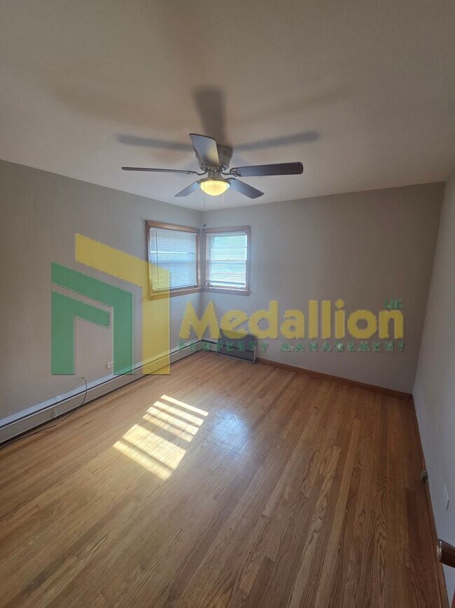 Building Photo - Spacious 6-Bedroom Home with Finished Basement and Backyard