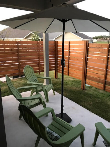 Back patio with privacy fence - 330 Rose Dr