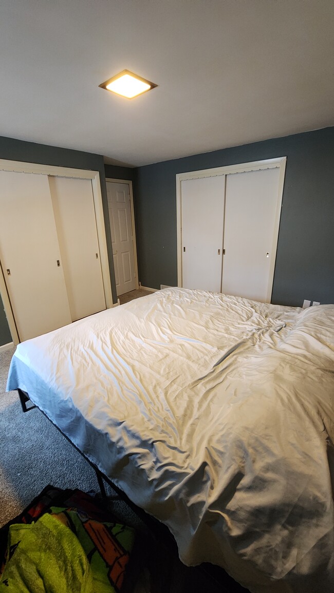 First floor bedroom w/ dual closets. - 1718 S Walden Ave