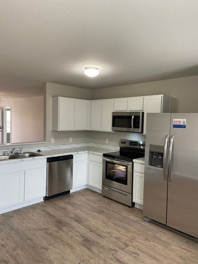 Building Photo - Now Pre-Leasing — Spacious 4-Bed, 2-Bath Home in Conrad Court Available 6/26