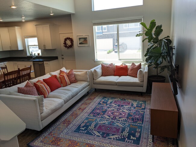 Living room features vaulted ceilings and open floor plan - 4312 E Grassland Way