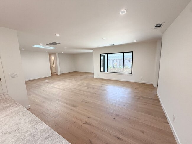 Building Photo - This premier 4-bed, 3-bath estate spans 2,565 sq. ft. on a 10,253 sq. ft. lot in North Los Altos.