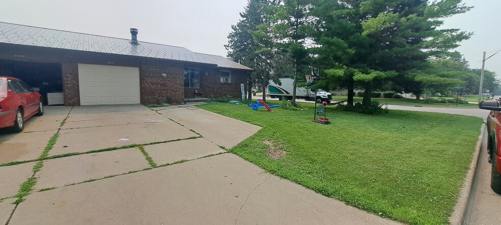 Front yard and 3 parking spaces - 2611 Clive St