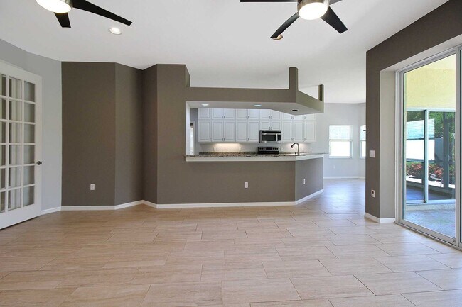 Building Photo - Annual rental: Spacious 3BR/2BA Creekwood Home with Office, Screened Lanai, EV Charger & Resort-S...