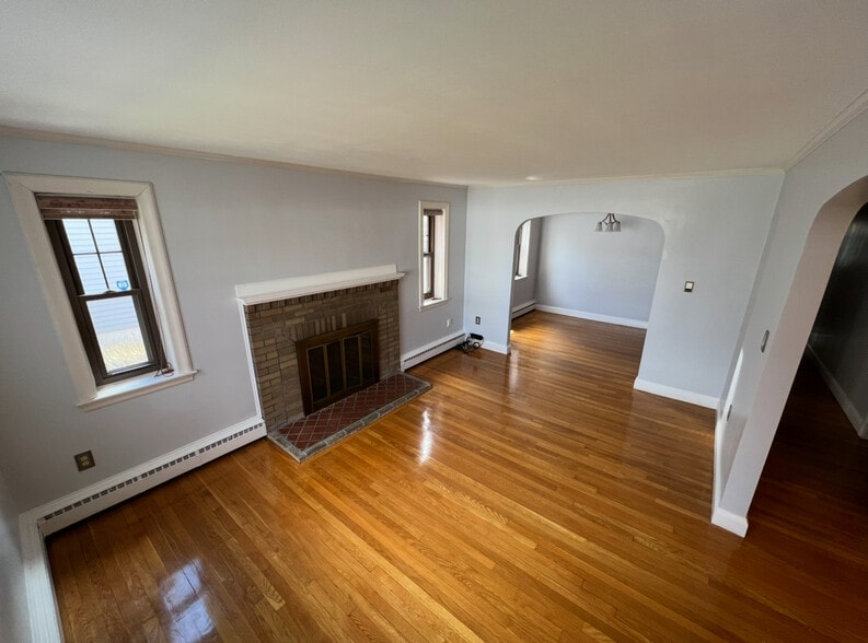 Living room with quasi dining room sectioned out. - 202 Orient Ave