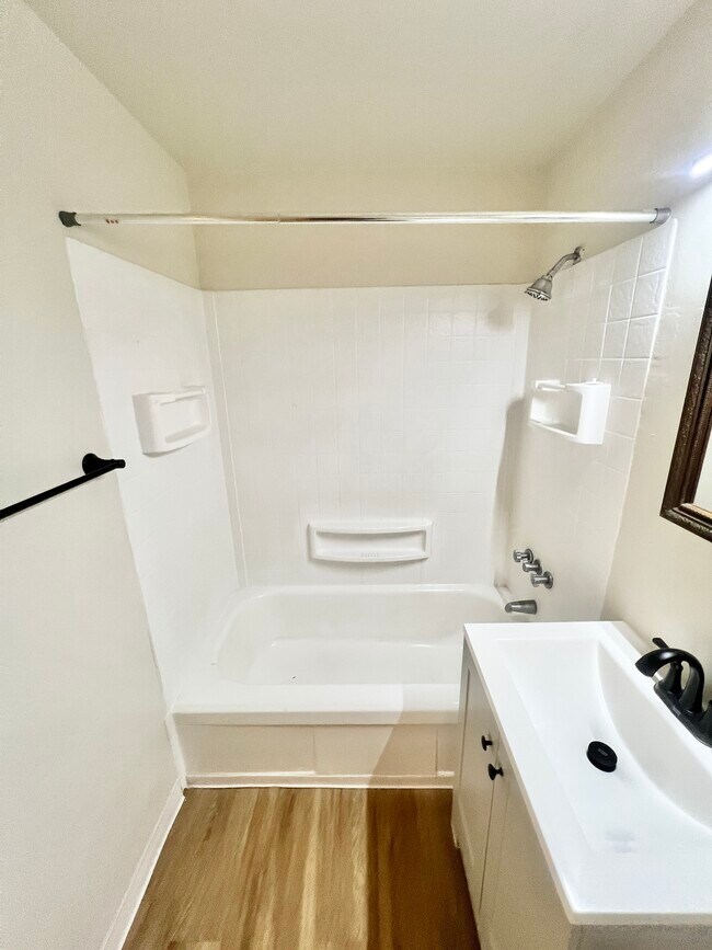 Experience elegance in a beautifully designed bathroom, perfect for relaxation. - Harmony Apartments
