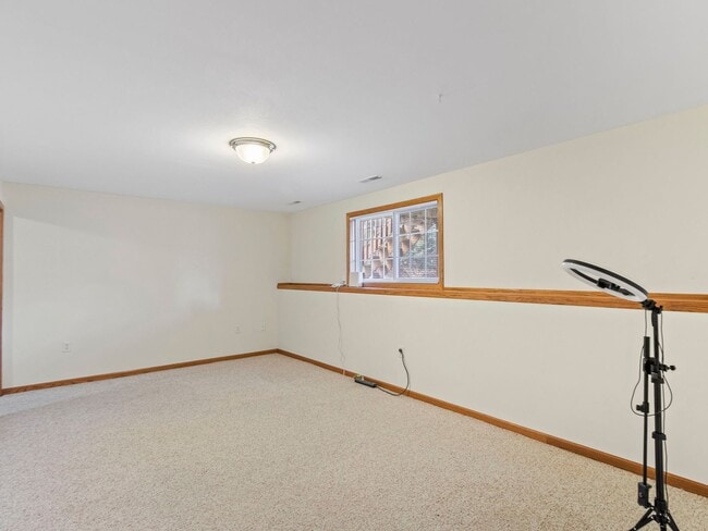 Building Photo - Spacious 3BR/3BA Condo with Finished Basement + 2-Car Garage — Available Now