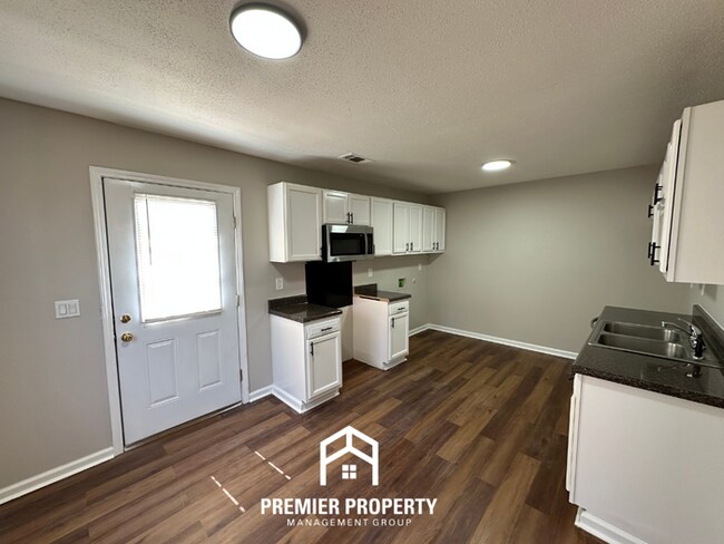 Building Photo - Spacious 4BR/2BA Home in 38141 | Vinyl Flooring & Large Fenced Backyard