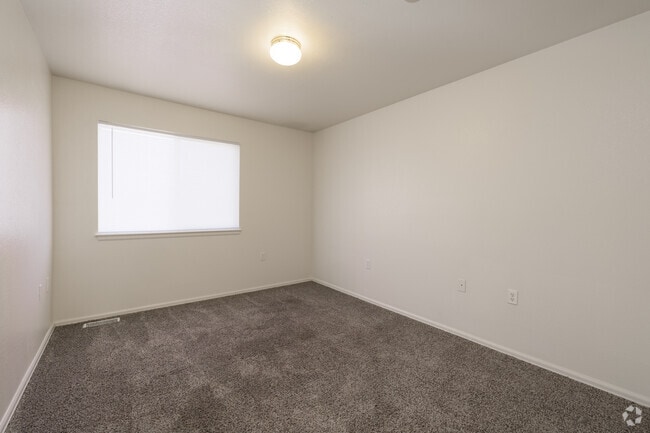 3BR, 2BA - 1,148SF - Primary Bedroom - Stonegate Village Apartments