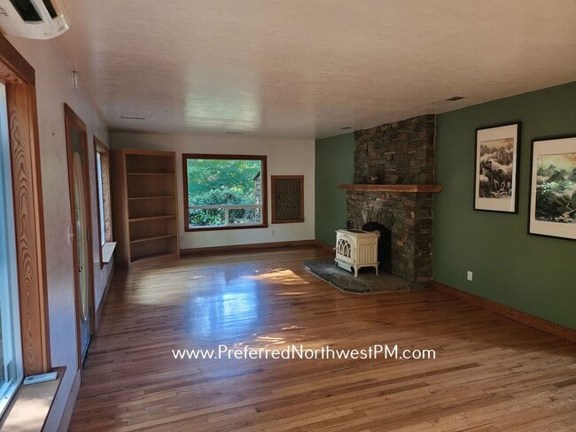 Building Photo - Beautiful home on 2 organically-landscape ...