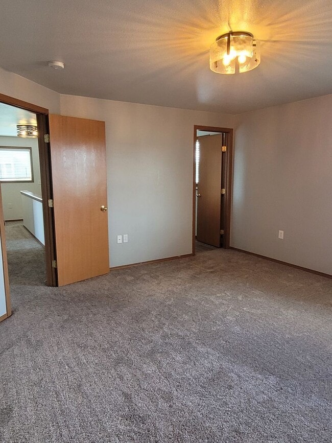 Building Photo - August Rent FREE - 4 Bedroom / Triple Car Garage