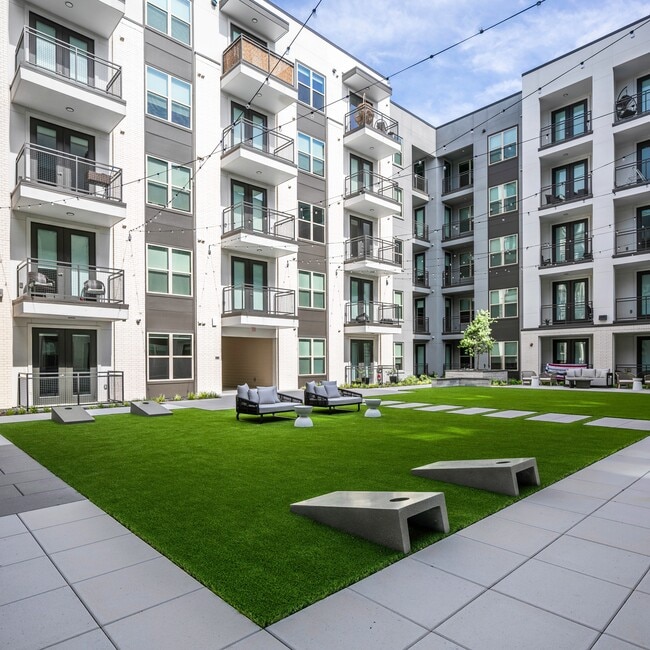Active courtyard with lawn games - Six Pines Market Square