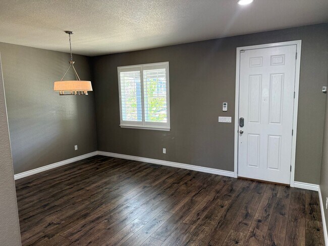 Building Photo - Greenbelt-Backed Wheatlands Home - Mountain Views, 3 Car Garage & Finished Basement
