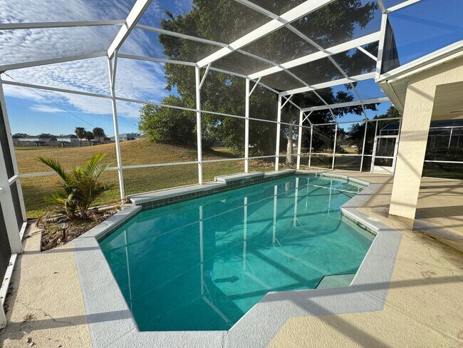 Building Photo - Spacious 4-Bedroom Home with Private Pool and Modern Comforts