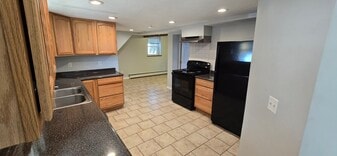 Kitchen looking toward dining nook and Bedroom 2 - 103 S Main St