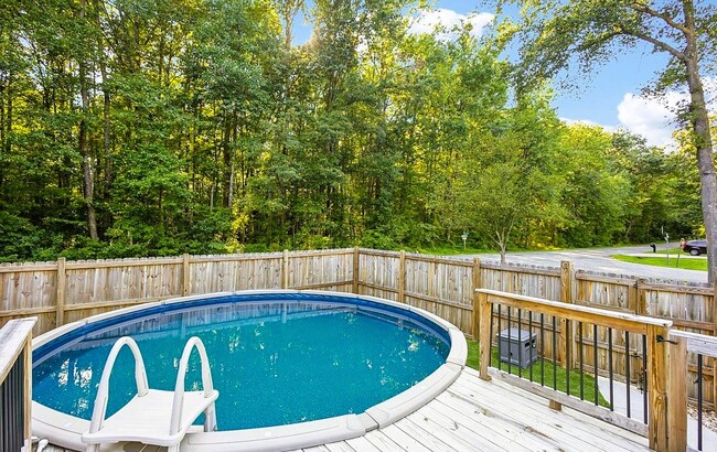 18 ft above-ground pool with a deck - 34 Shenandoah Dr