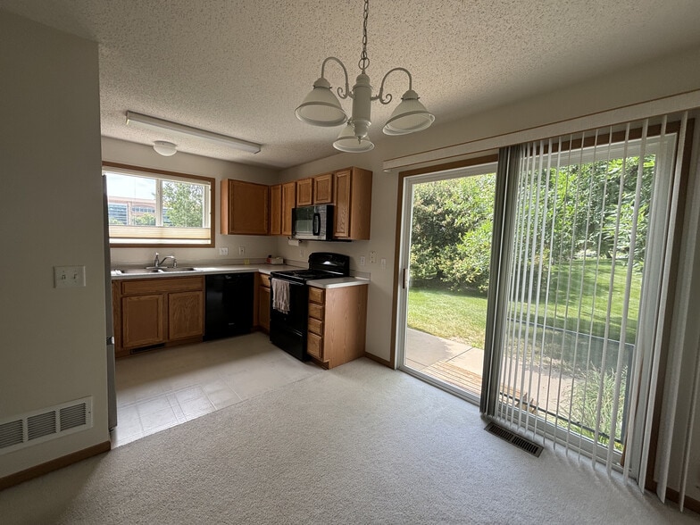 dining room and kitchen - 7792 Village Pl