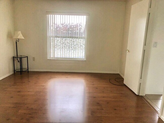 Building Photo - Nice 2X2 located on 2nd floor- Tile & lami...