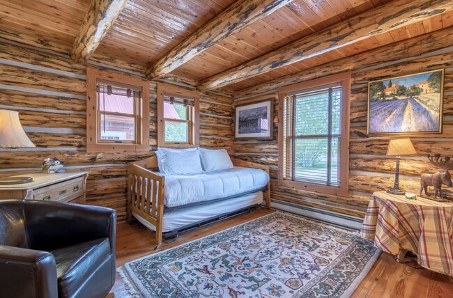 Building Photo - Charming Log Cabin and Carriage House – Do...