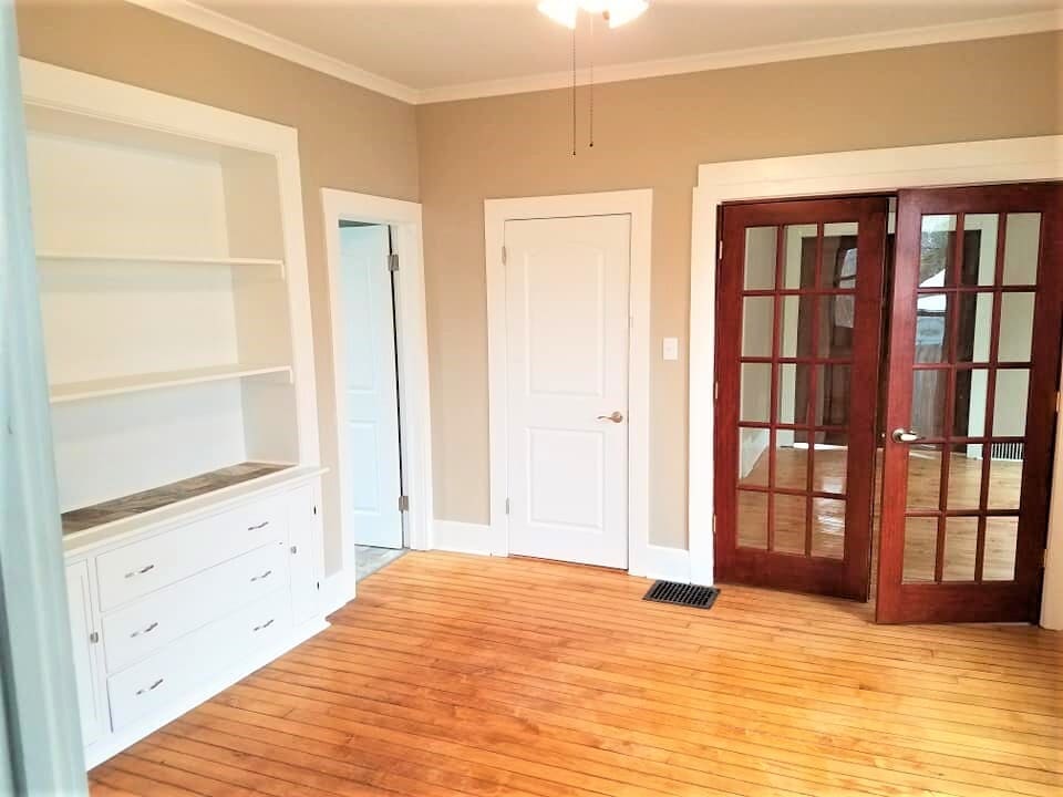Dining room with hutch and double doors - 2104 Folger Ct