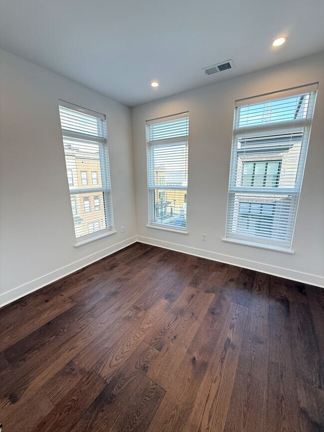 Building Photo - Brand new 4 level, 4 Bedroom Townhome with Elevator!