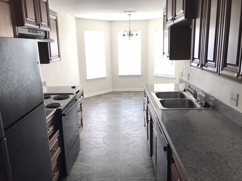 Eat in Kitchen with granite countertops and appliances. - 2204 Irma circle