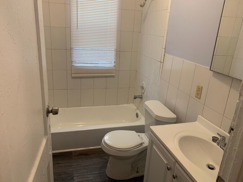 Bathroom off hallway with bathtub & shower - 1135 SW 6th St