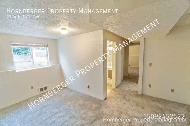 Building Photo - 4124 E 34th Ave