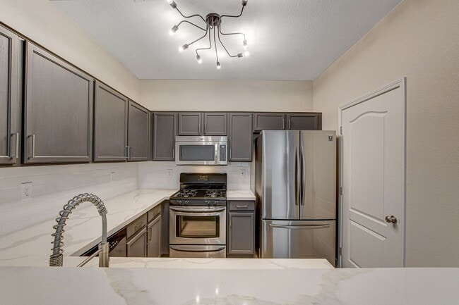 Building Photo - Upgraded First-Floor Condo in a Gated Summ...