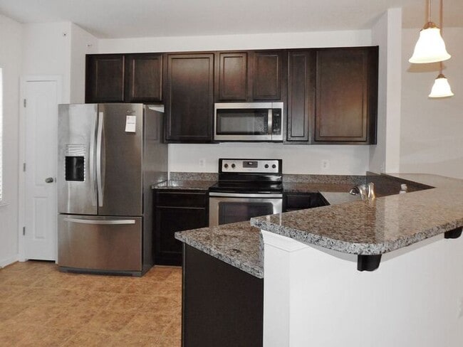 Building Photo - Pet Friendly Condo with Deck and 1 Car Garage