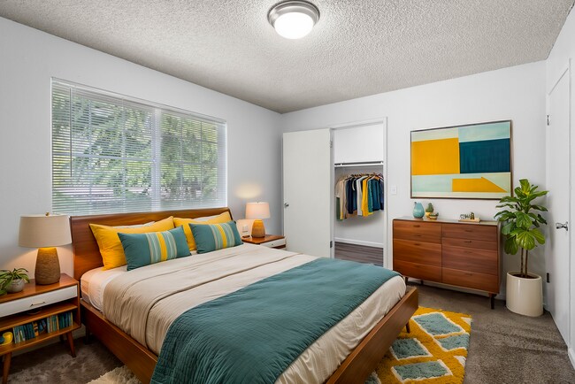 Relax in this beautifully designed bedroom offering comfort and style. - University Crossing Apartments