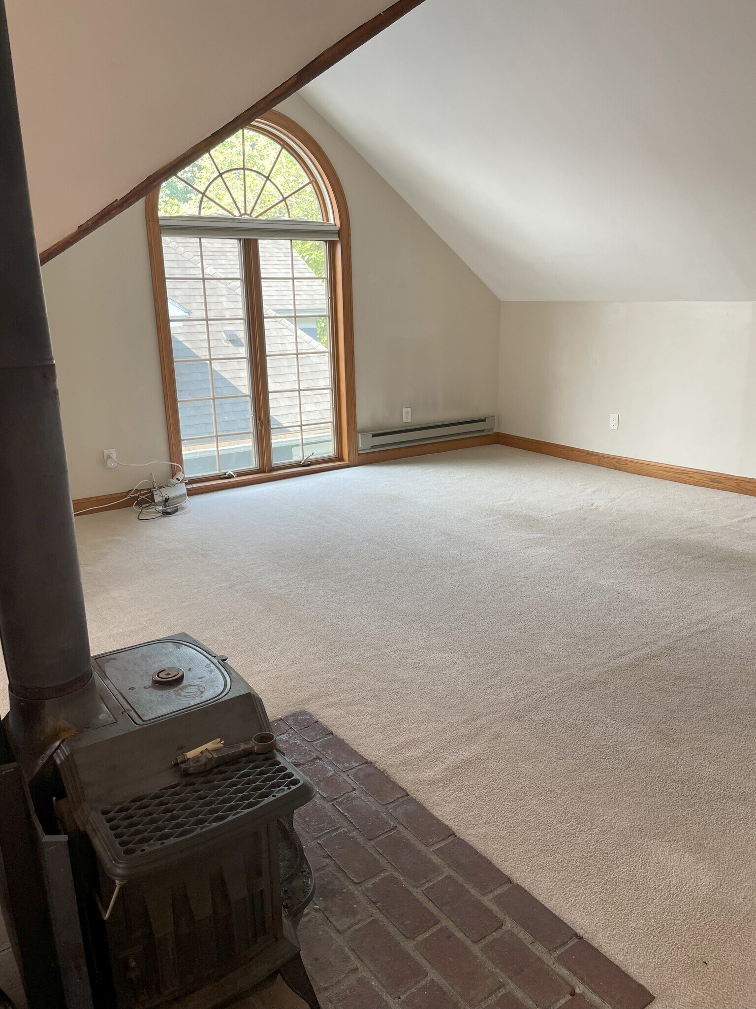 3rd floor bedroom or living room with wood burning stove - 120 Edgerton St