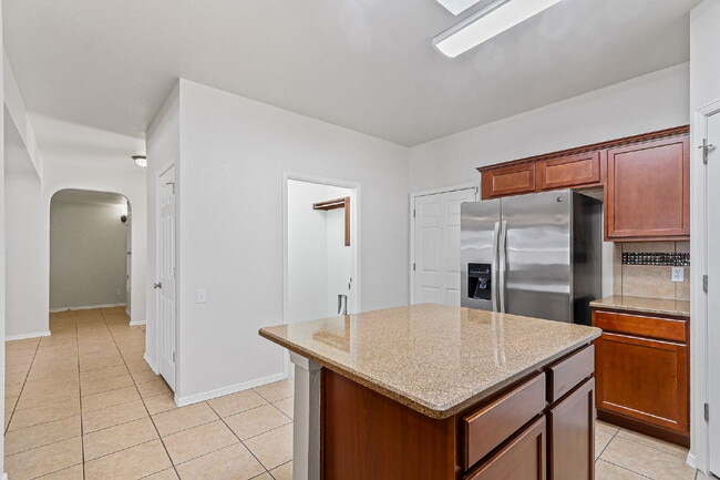 Building Photo - "Spacious 4-Bed Oasis with Granite Touches...