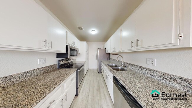 Building Photo - 2 + 2 Spacious 2-Bedroom Condo with Top-Ti...