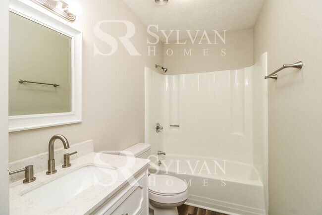 Building Photo - Enjoy living the good life in this 4 BR, 3 BA brick rancher